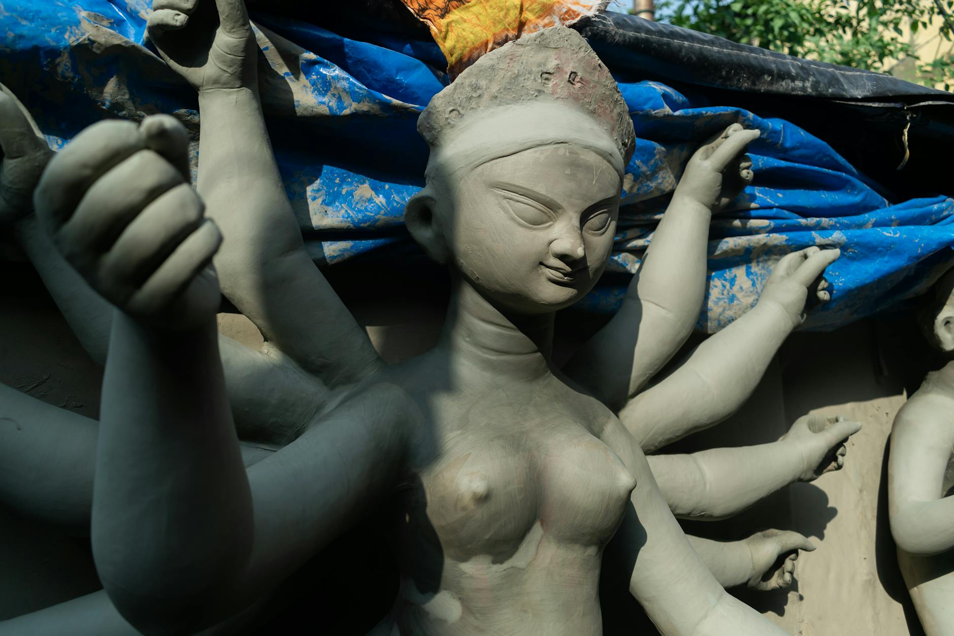 Close-up of a clay sculpture of Goddess Durga in Kolkata, capturing the artistry and detail.