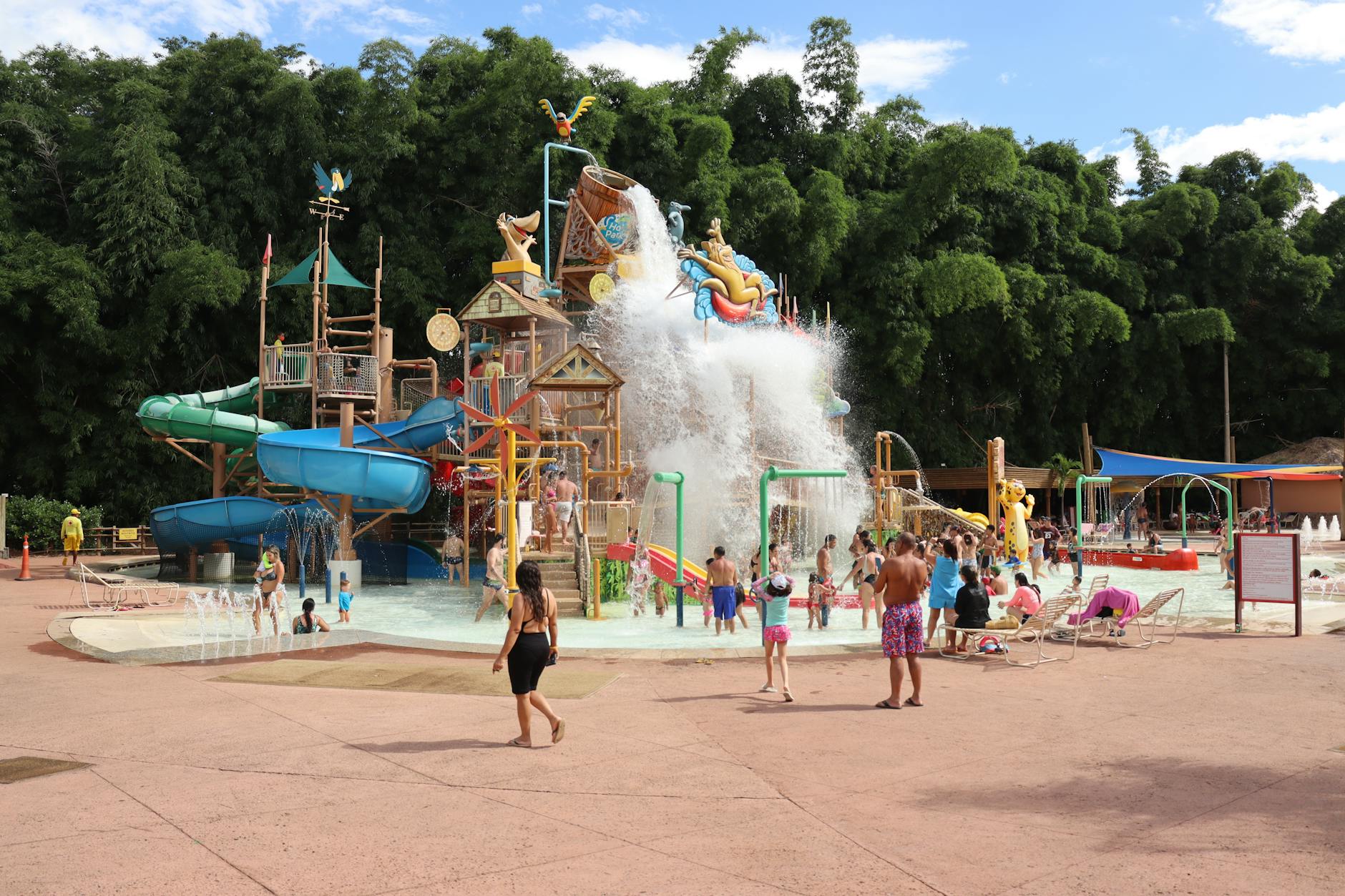 Families enjoying a lively day at Rio Quente's colorful water park with slides and splash zones.