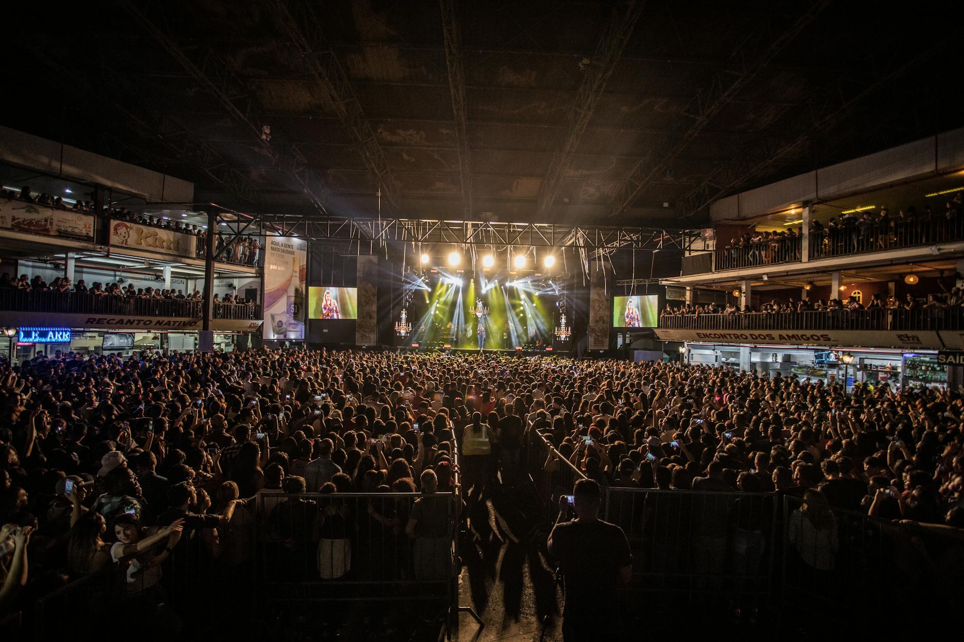 A lively indoor concert with a massive crowd in São Paulo, capturing the essence of live music and entertainment.