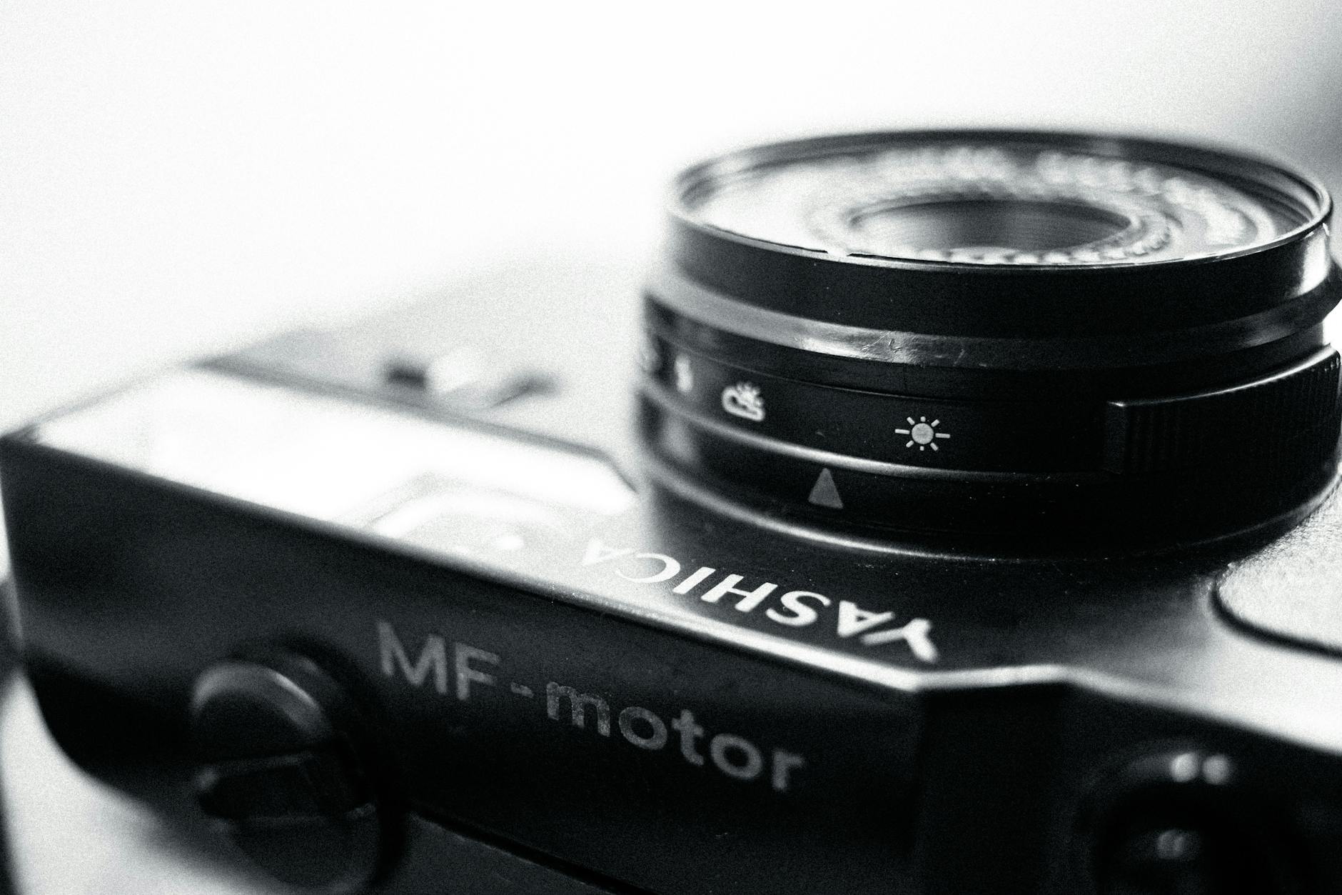 Close-up view of a vintage Yashica camera lens showing detailed settings and classic design.