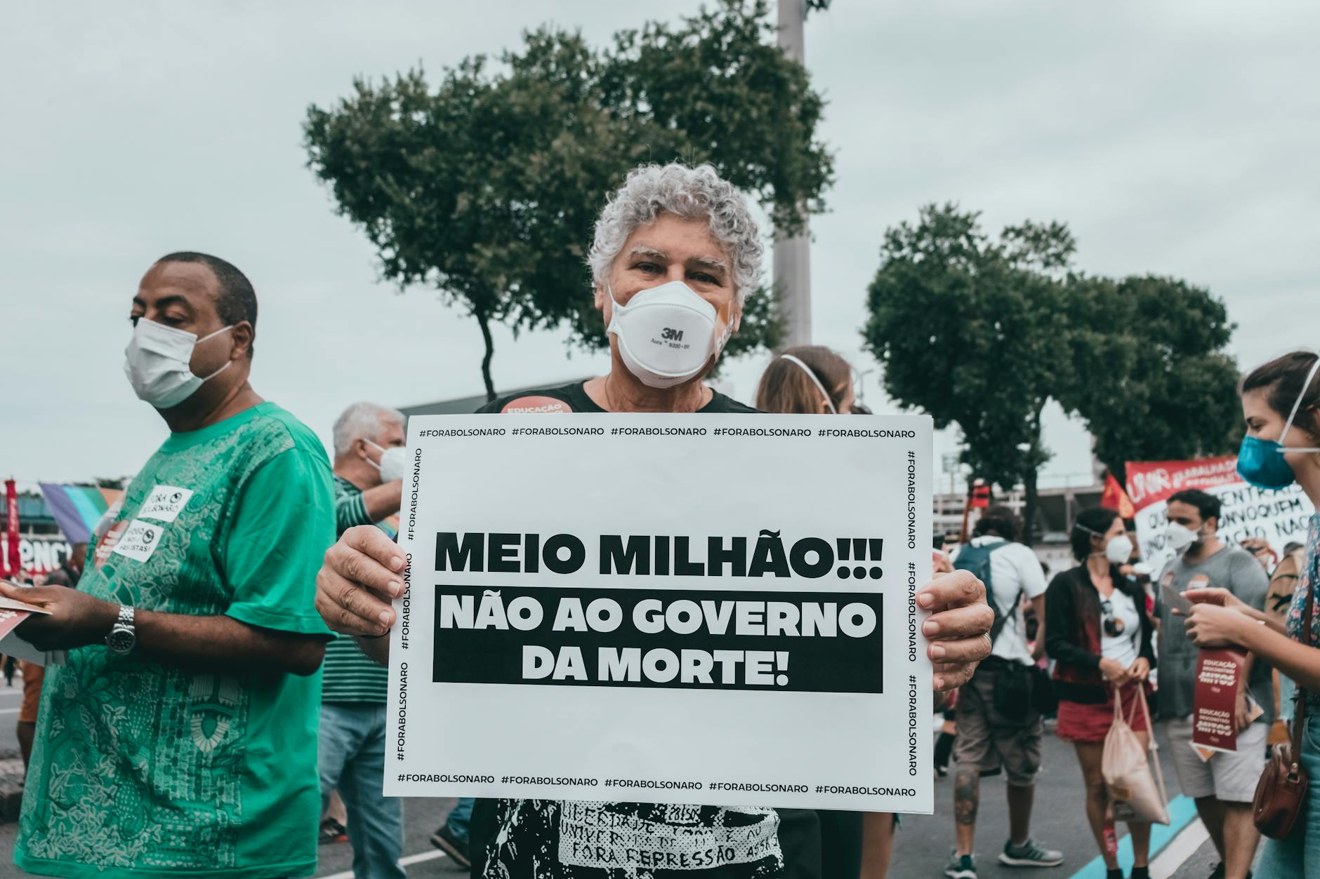 Large group of people in Rio de Janeiro protesting against government policies during a day event.