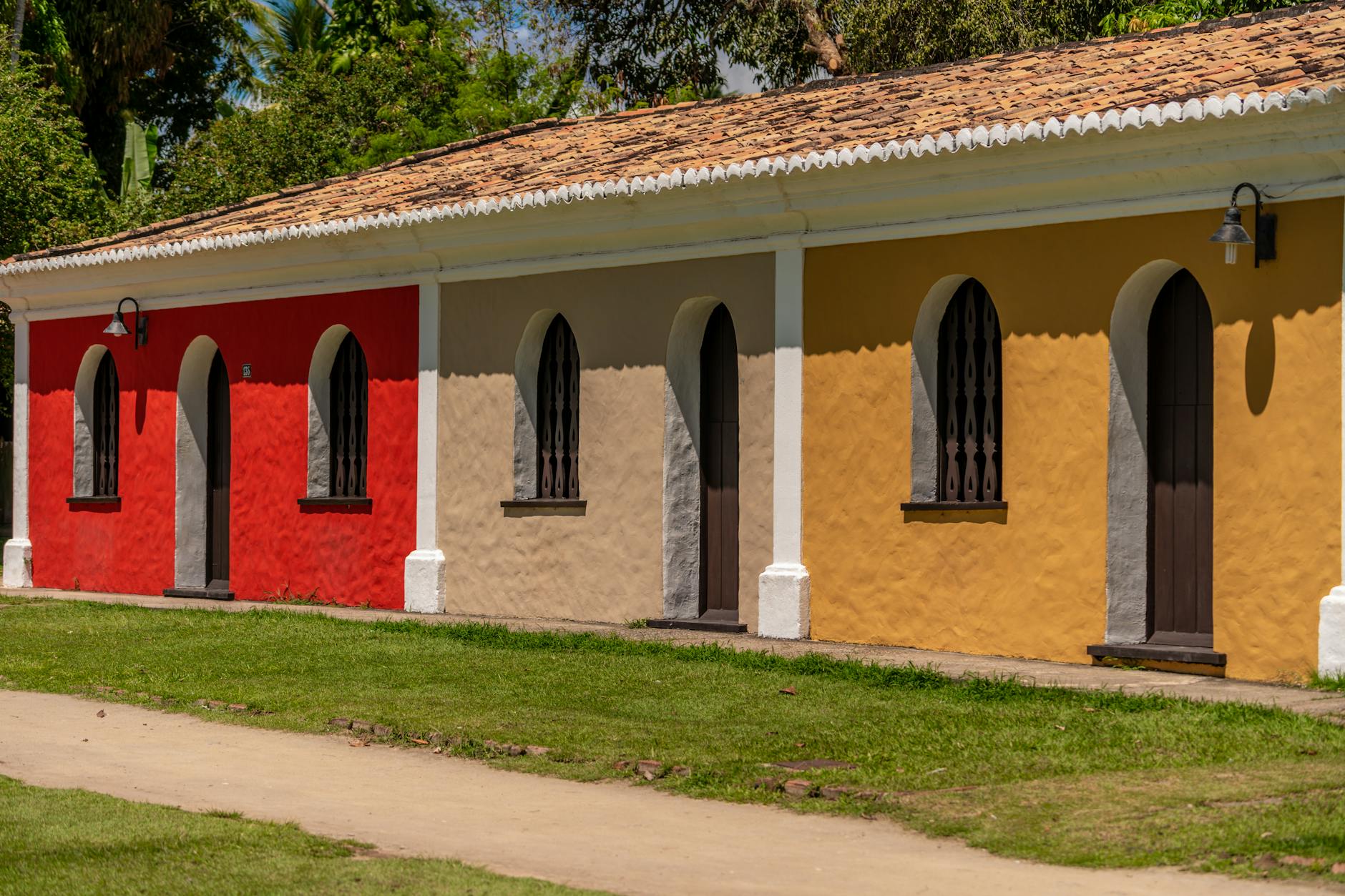 Vibrant colonial architecture in Porto Seguro, Brazil, showcasing colorful facades in a sunny setting.